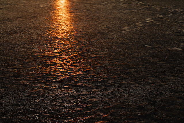 Melting Ice on a Lake during a Sunset during Winter