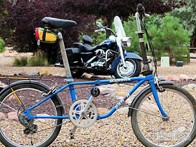 Picture of Dahon Mariner folding bike with Harley Davidson motorcycle in background