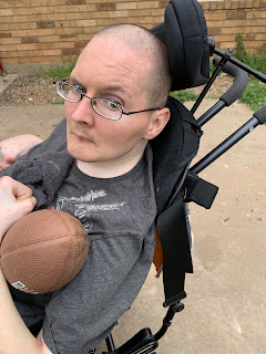 Chris holding a football