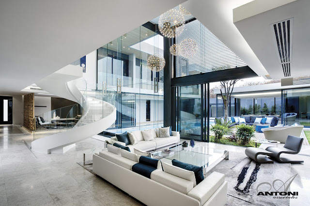 Picture of white living room furniture with the exit to the backyard and the terrace