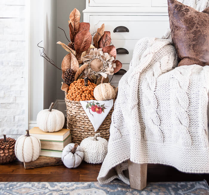 woven basket, pumpkins, fall stems, cable knit throw