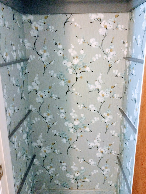 perfectly wallpapered closet