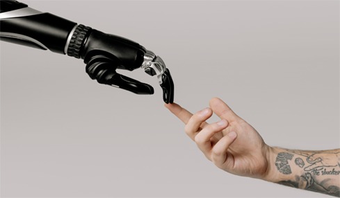 bionic arm touches a human finger