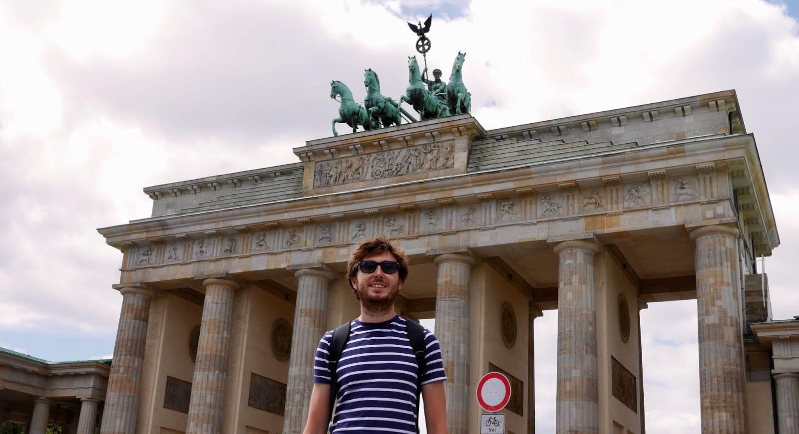 Cal Mc standing at the Brandenburg Gates, by www.CalMcTravels.com. Cal McTravels
