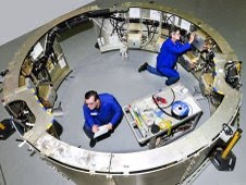 Gary Postlethwait, right, and Bert Priest, test technicians with ATK Aerospace Systems of Magna, Utah, make final preparations for testing inside the avionics mounting structure. Credit: ATK