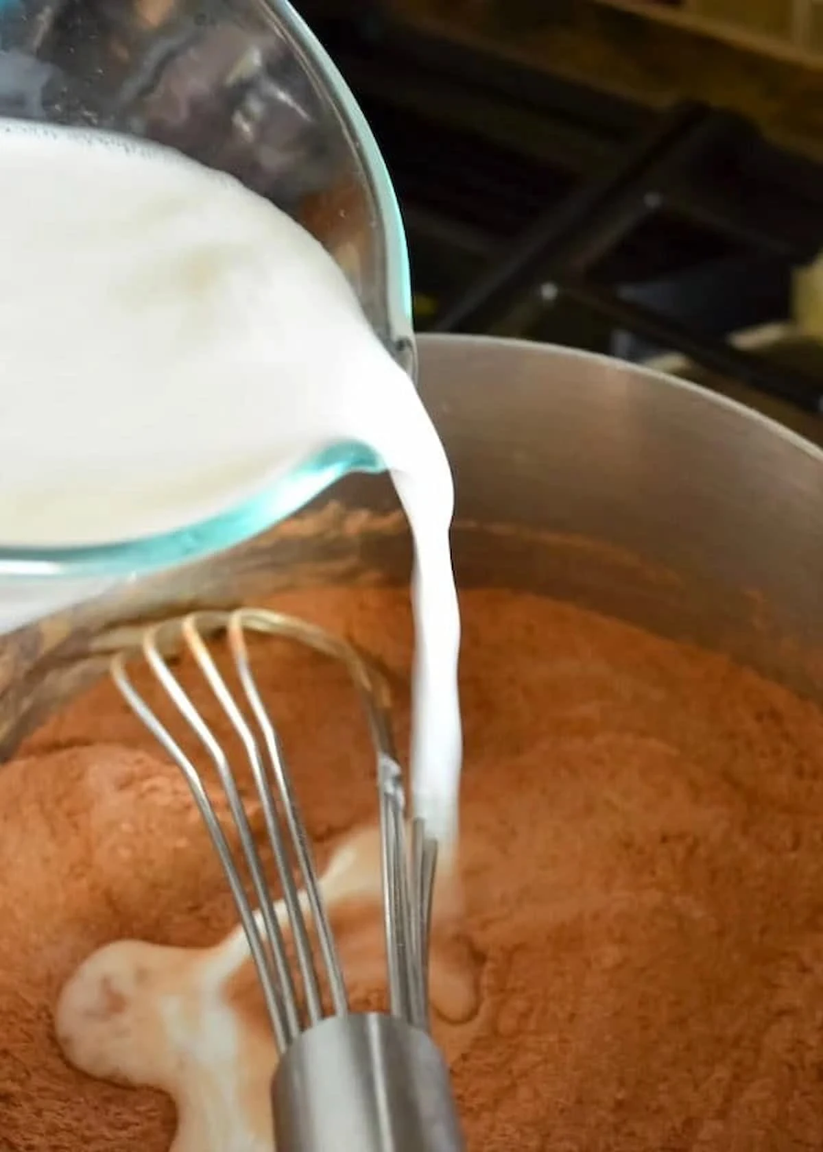 Milk being whisked into Chocolate Cream Pie Filling.