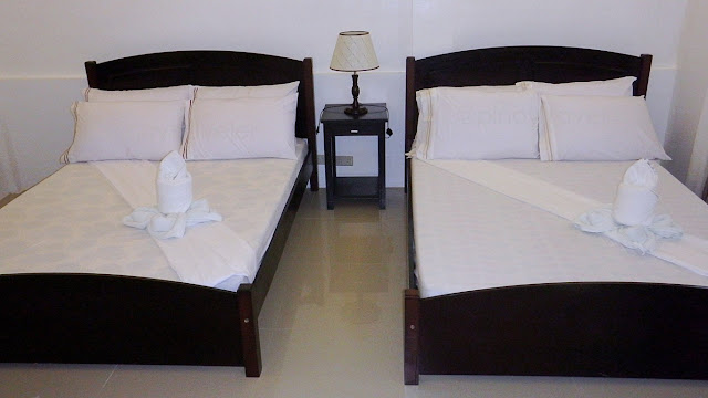twin beds at a room of Juvie's Resort Hotel and Restaurant in San Roque, Catbalogan Samar