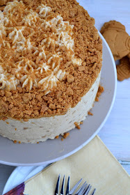 Dark gingerbread cake with cream cheese frosting incorporating crushed ginger nut biscuits