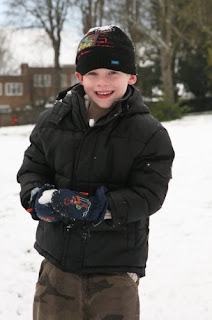 Nathan looks all innocent but check out the snowball in his hands!