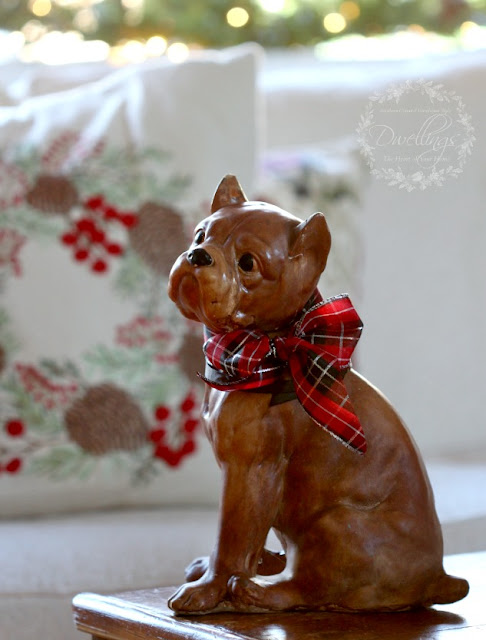 The cutest antique chalk boxer with plaid Christmas ribbon.