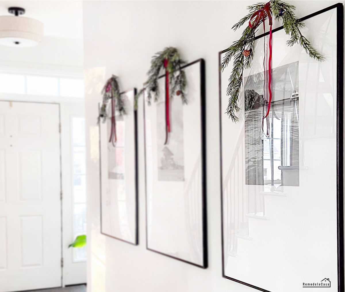 foyer and hallway decorated for the holidays