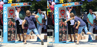 A kid on a carnival punch stand