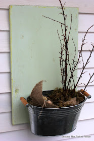 an old cupboard door and metal tin makes a great planter