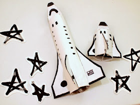 make some cardboard space shuttles with your kids