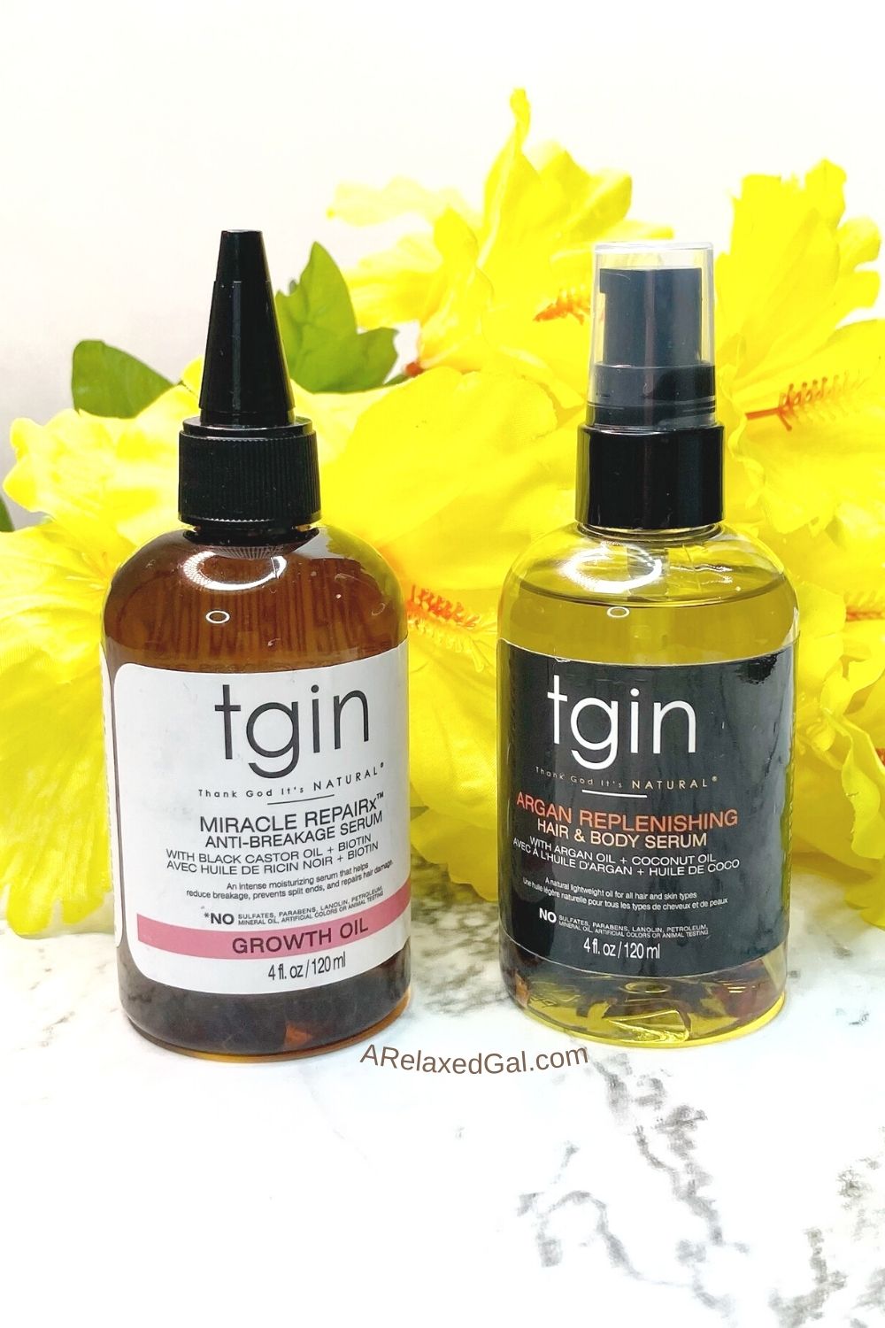 tgin anti-breakage and argan oil serums in front of yellow flowers.