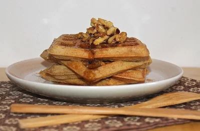 Side view of a stack of whole wheat acorn squash waffles.