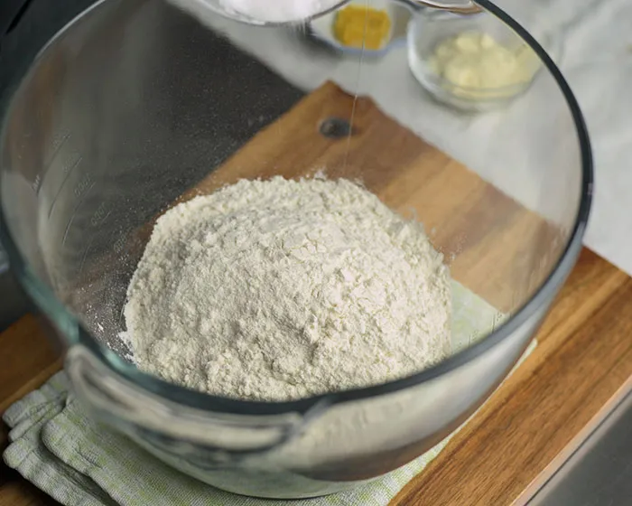 high protein flour into a mixing bowl.