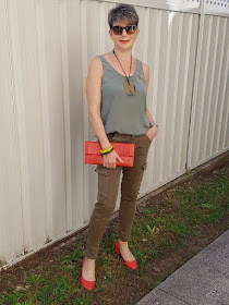 Green cargo pants-green sleeveless top-red shoes|red hadnbag
