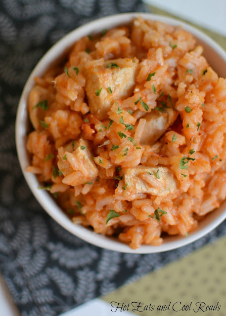 A delicious chicken and rice dish from Burkina Faso! So flavorful and also great with beef or lamb! Riz Gras aka Fat Rice with Chicken Recipe from Hot Eats and Cool Reads