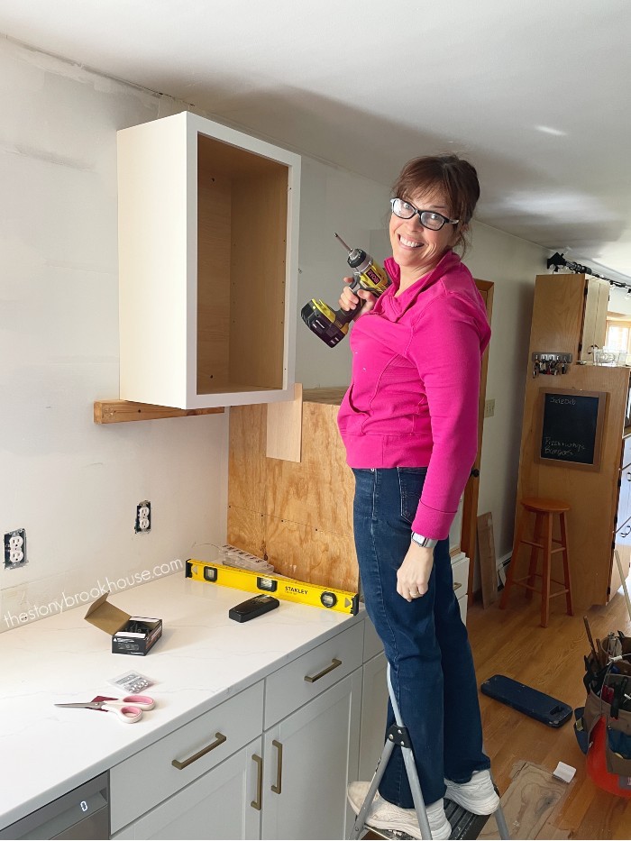 Installing wall cabinet