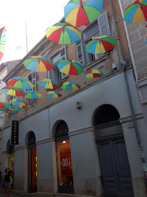 Some 3D bunting displayed on a busy shopping street