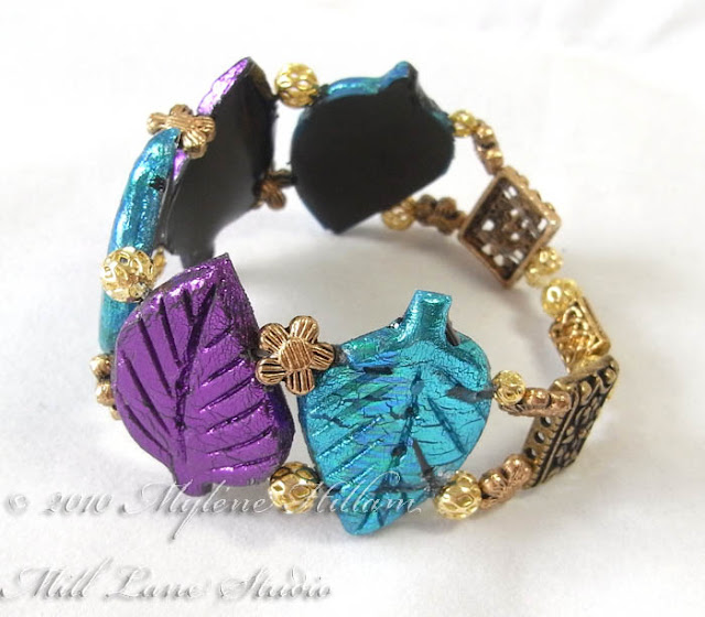 Purple and Turquoise Friendly Plastic leaf bracelet from the side view. It shows the metal spacers around the back of the bracelet.