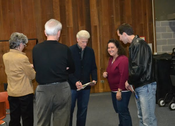 dennis benatar. the left of Dennis signing