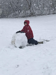 student making a snowball 