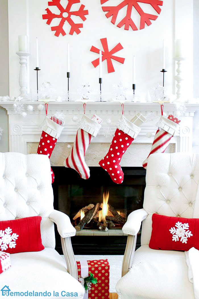 red snowflakes and stockings on mantel decor