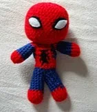 http://www.ravelry.com/patterns/library/spiderman---mini-doll-crochet-pattern