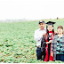 Inspiring photo shows college grad standing in the fruit fields where her immigrant parents work