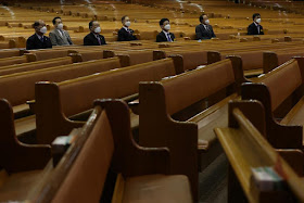 Christian faithfuls wearing masks to prevent contracting the coronavirus sit during a service at a church in Seoul, South Korea, March 1, 2020. Photo: Yonhap via Reuters