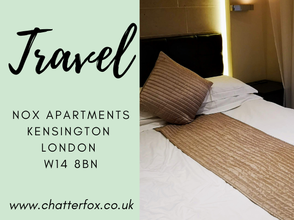 Image of the bedroom at Nox Kensington. The bed has white bed linen and gold satin accessories. To the left of the image is a title that reads 'Travel Nox Apartments, Kensington, London W14 8BN