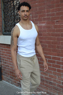 Carter wearing a white ribbed tank and beige Ponte joggers