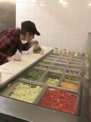 Cellphone footage shows an employee of Canadian food chain Pita Pit spitting in a customer's food during a bust-up. The outraged customer believed to be a lady could be heard saying "I f*cking dare you" to the unethical food-server.  Customer continued: "I f*cking was nice to you", the customer shouts, "you were a f*cking bitch".
