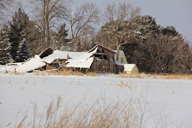 a collapsed barn