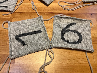 gray knitted milestone blocks number pieces being seamed together