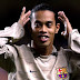 Watch footage of Ronaldinho playing foot volleyball with prison inmates while awaiting trial