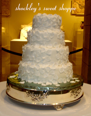 This Wedding cake was decorated entirely of White fondant Rose Petals 