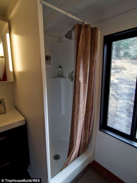 The tiny house has a shower and toilet. - This Couple Got Out Of The Rat Race. And Built This Tiny Home For $33K.