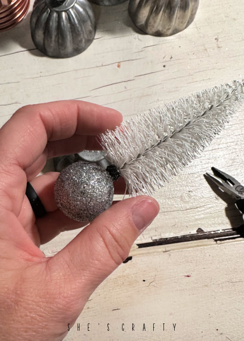 Bottle brush trees in shatterproof ornaments.