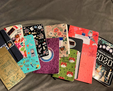 several sizes and types of notebooks