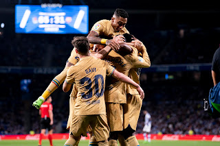 Barcelona players celebrate 4-1 victory over Real Sociedad in La Liga match