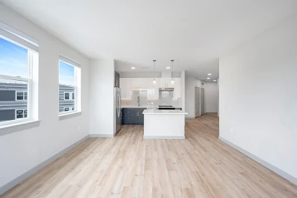 Kitchen and open living space in apartment at The Val