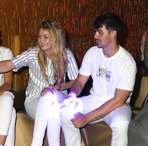 gigi-hadid-joe-jonas-1-vogue-23july15-splash-exc_b_592x888