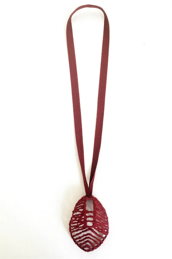 red paper pulp pendant on red ribbon necklace