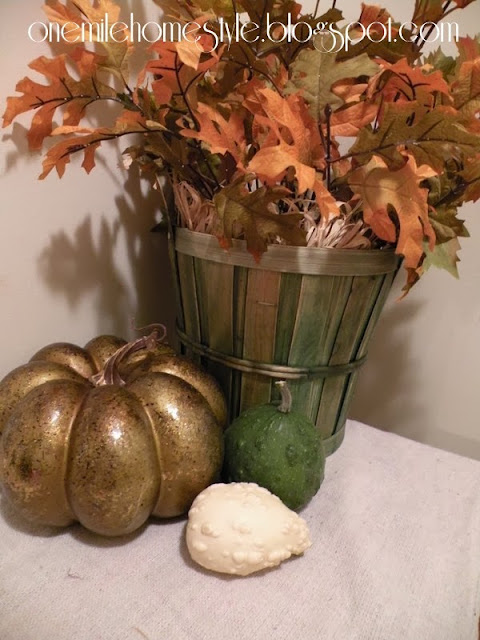 Gold pumpkin and green basket fall decor