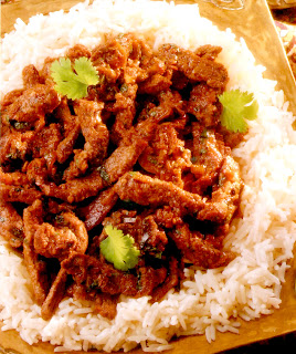 thai green curry of beef served on a bed of rice