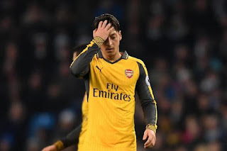 [Photos] Angry fans Attack Mesut Ozil After Etihad Defeat