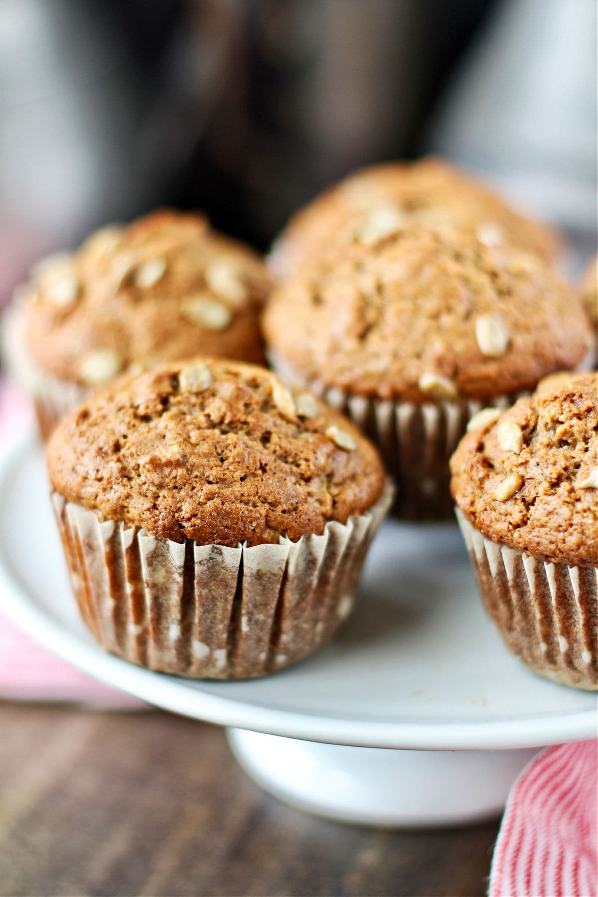 Whole Wheat and Sunflower Seed Muffins on a cake stand.